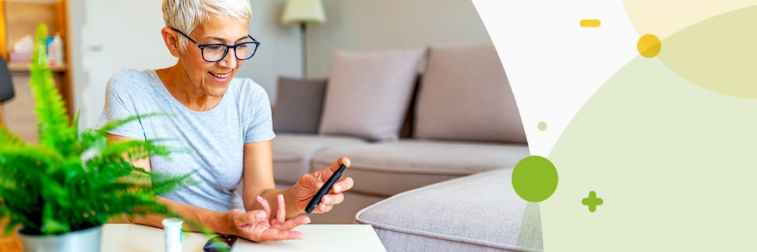 Woman with white hair pricking her finger to measure blood sugar
