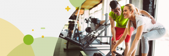 Trainer exercising in a gym