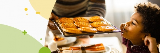 Little boy looking at fresh baked cookies