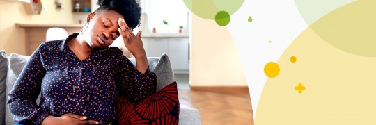 Woman holding her head and her belly in pain